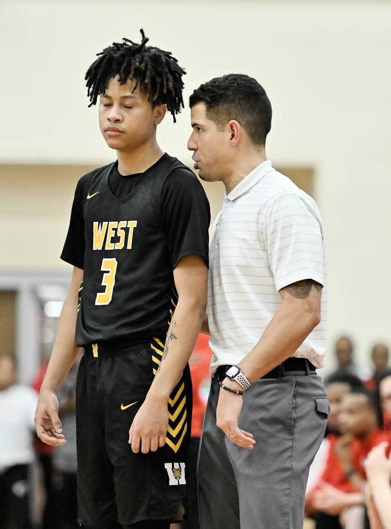 Joliet West's head coach Jeremy Kreiger talks with Tristian Saunders (3)  during the Class 4A sectional semifinal against Homewood Flossmoor at Rich Township on Tuesday, Feb. 27, 2024, at Richton Park. (Dean Reid for Shaw Local News Network)