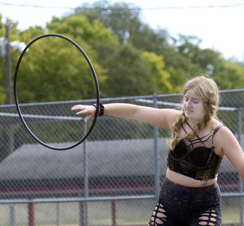 Mali Rachel entertains the crowd and shows her skills with a hoop Saturday, Sept. 14, 2024, during the Marseilles Renaissance Faire.