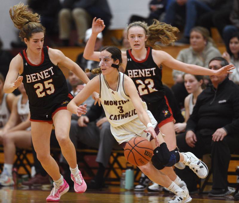 Montini's Nikki Kerstein, middle, gets past Benet's Shannon Earley, left, and Bridget Rifenburg during the semifinal of the Montini girls basketball tournament Thursday December 28, 2023 in Lombard.