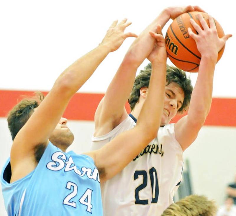 Marquette's Nick Melvin (20) grabs a rebound over Bureau Valley's Mac Nugent (24) during action in the 9th-place game at the 2019 Colmone Classic at Hall High School in Spring Valley.