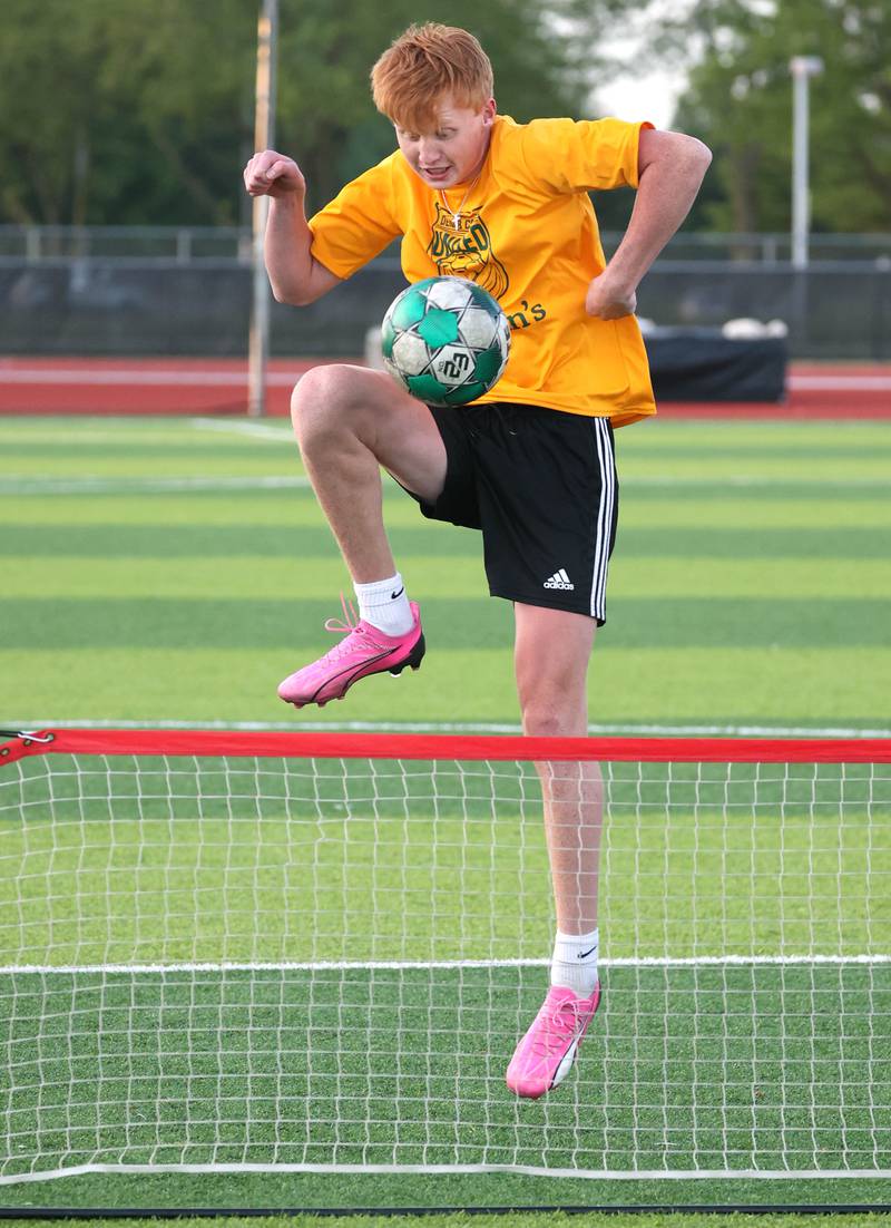 DeKalb County United’s Carl Jameson, from Sycamore, plays soccer tennis Thursday, June 6, 2024, during practice at the Northern Illinois University Soccer and Track and Field Complex in DeKalb.