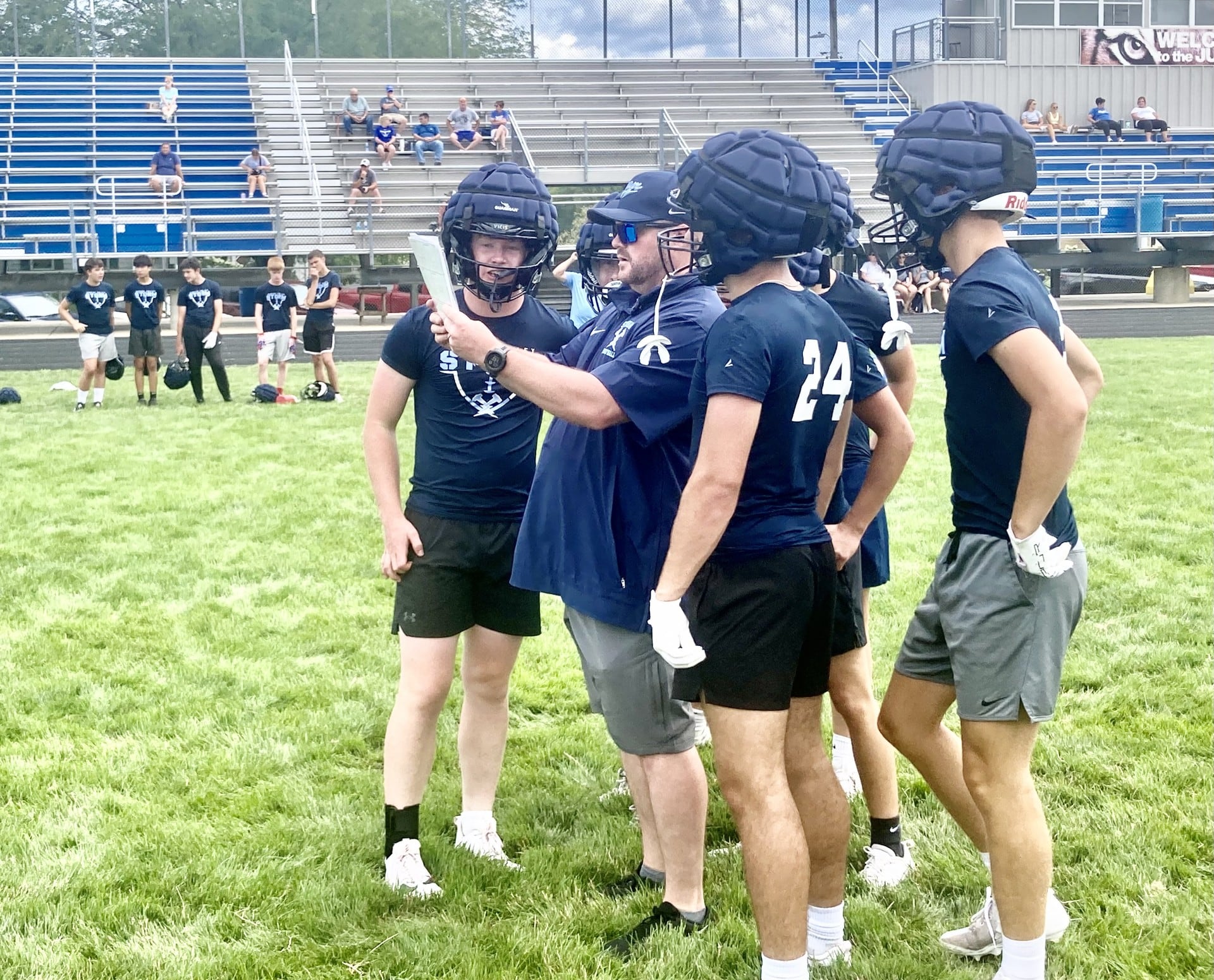 Bureau Valley head coach Mat Pistole looks at the next offensive play with his Storm offense during Saturday's 7 on 7 contest against Princeton.