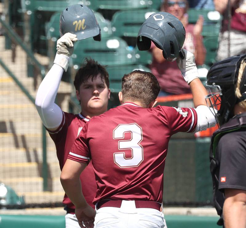 Morris' Cody DelFavero (right) is congratulated after homering by teammate Griffin Zweeres during their Class 3A state semifinal game against Crystal Lake Central Friday, June 7, 2024, at Duly Health and Care Field in Joliet.