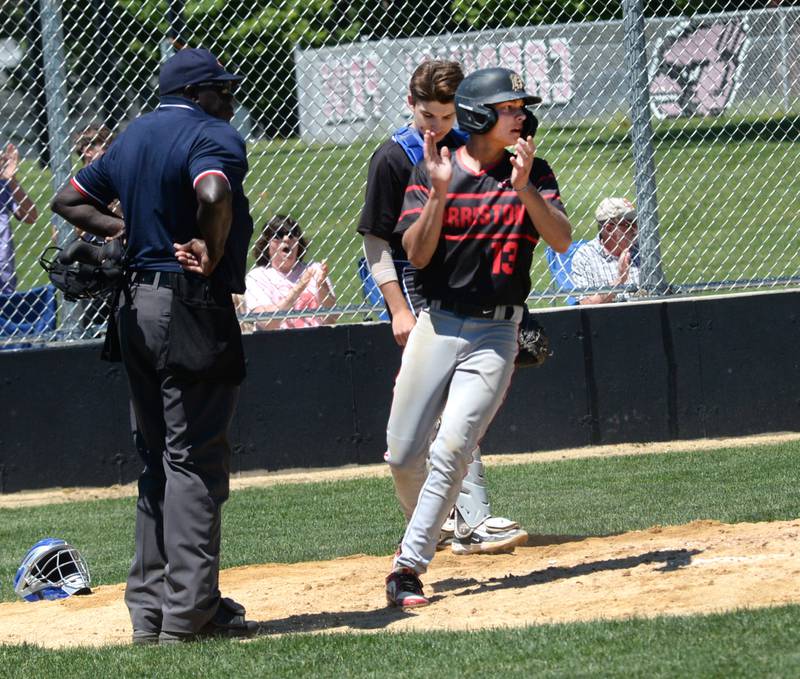Forreston's Kendall Erdmann celebrates after scoring the go-ahead run for the Cardinals during the 1A sectional championship game with East Dubuque on Saturday, May 25, 2024 at Forreston High School. East Dubuque scored two in the top of the seventh inning to win the game 4-3.