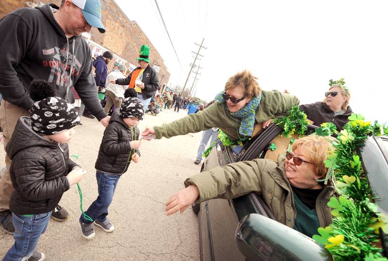 The "I Love Parades Gang", including Valerie, Donna (front) and Nancy hand out candy during the Yorkville St. Patrick's Day parade on Hydraulic Avenue, Saturday, Mar. 16, 2024.
