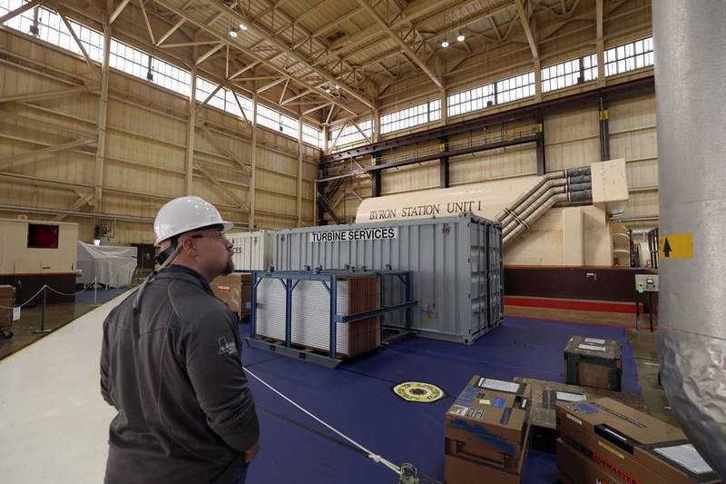 Design engineer Connor Friedrichsen walks through the steam turbine area of the Byron Generating Station Tuesday, Oct. 17, 2023, in Byron.