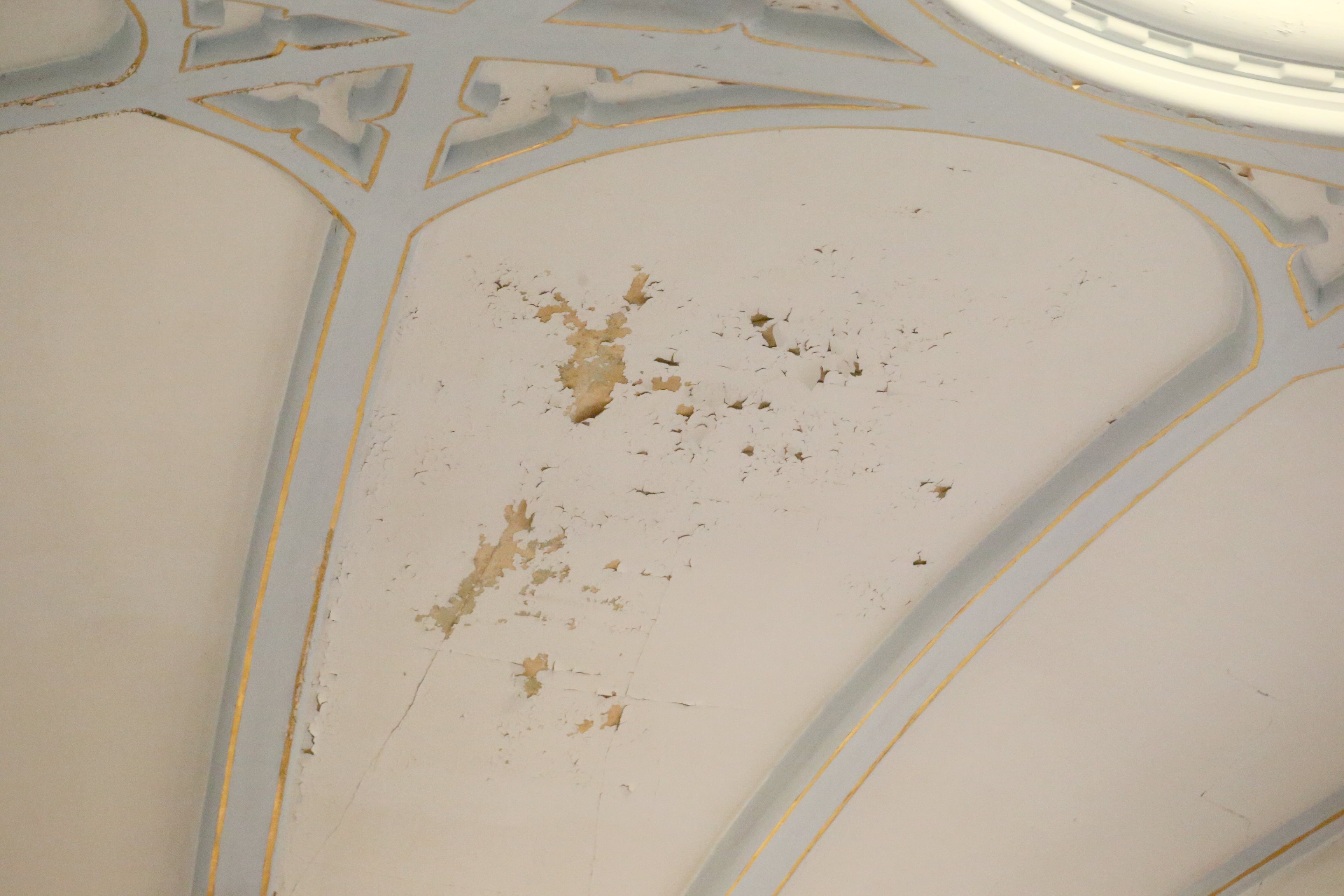 Cracks and chipped paint are noticeable on the celing during the final Mass at St. Mary's Church on Thursday, Aug. 15, 2024 in Peru. The church was founded in 1867.