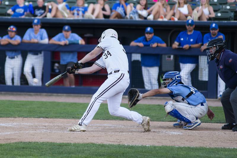 Joliet Catholic’s Jackson Cullen drives in the first run of the game against Columbia Friday, June 3, 2022 during the IHSA Class 2A baseball state semifinal.
