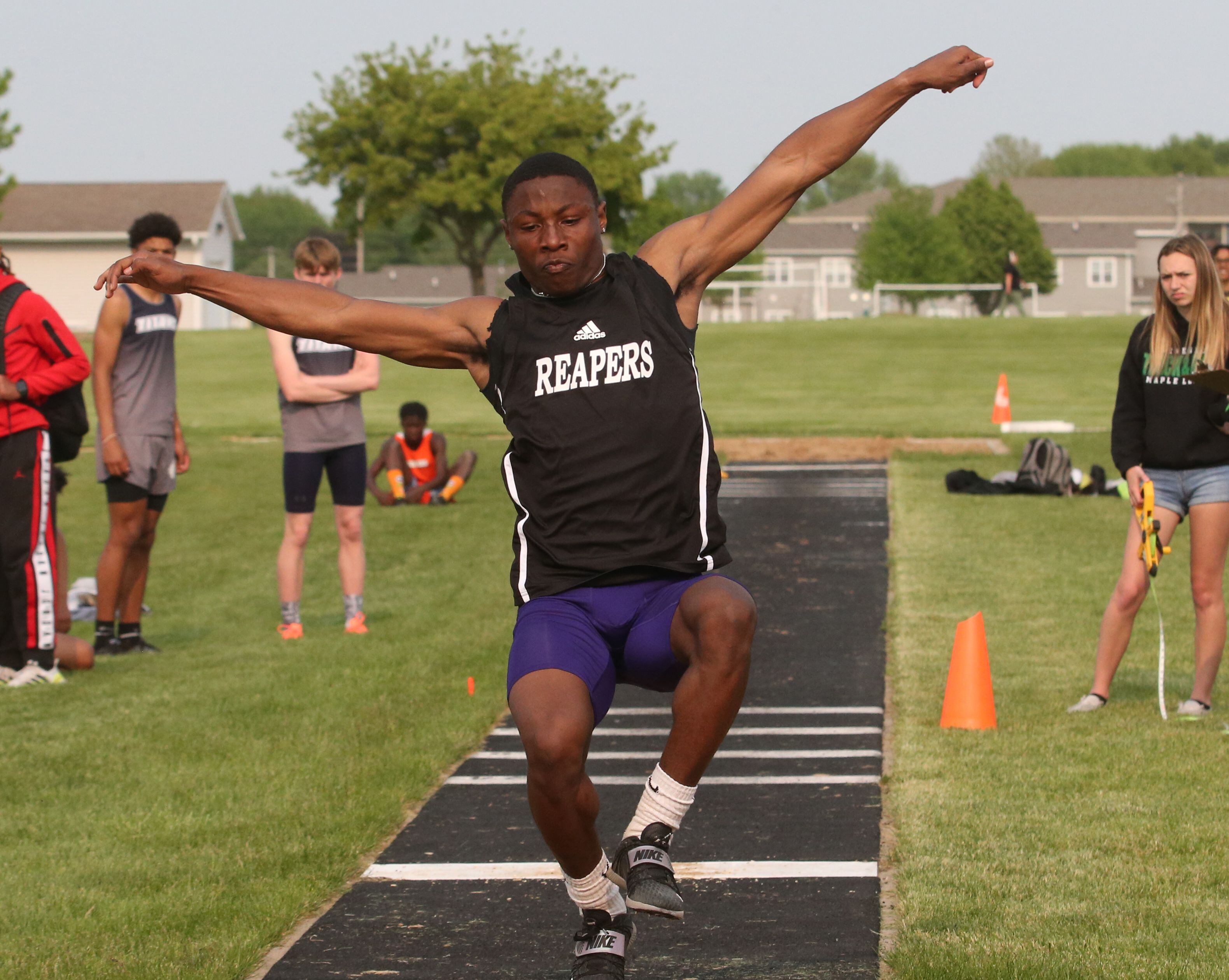 Plano's Waleed Johnson competes in the long jump during the Class 2A track sectional meet on Wednesday, May 17, 2023 at Geneseo High School. 