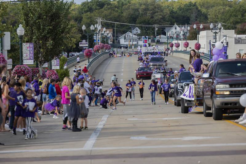 Kids scramble around for candy thrown from floats Friday, Sept. 29, 2023 during the Dixon homecoming parade.