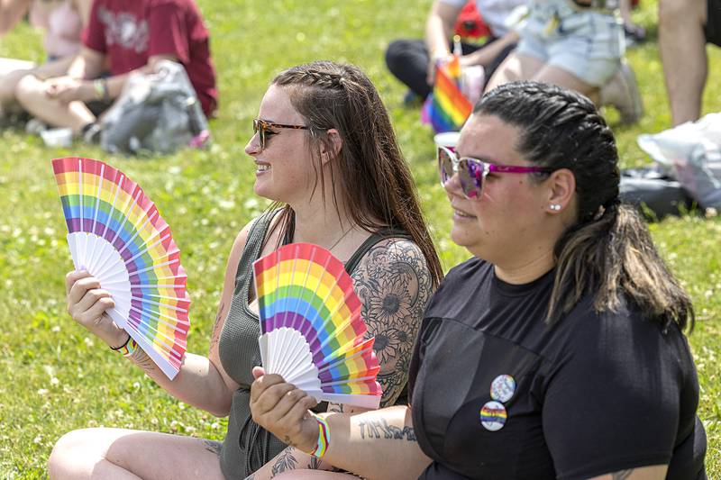 Calandra Vasquez (left) and Linsey Hepker, both of Sterling, watch a performance Saturday, June 15, 2024 at Dixon Pride Fest.