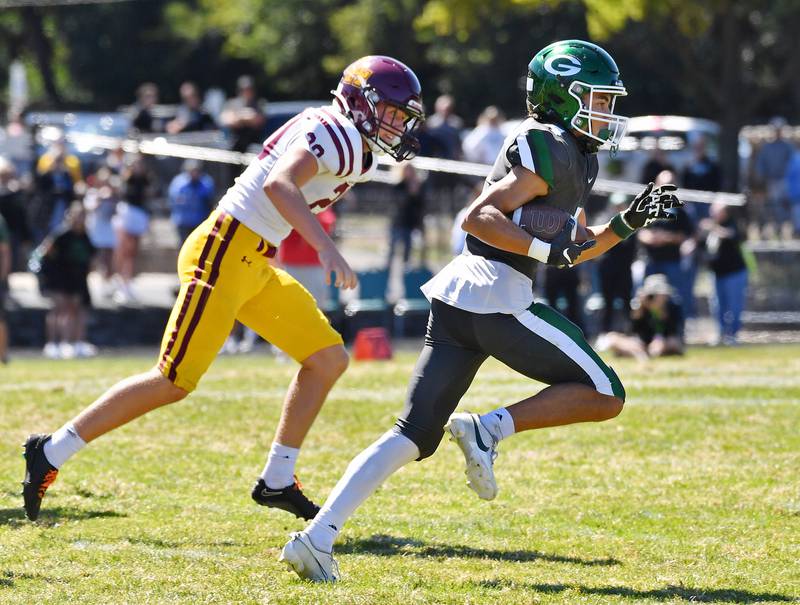 Glenbard West's Mason Ellens (right) breaks free for a 94 yard kickoff return before being stopped at the five yard line during a game against Loyola on September 7, 2024 at Glenbard West High School in Glen Ellyn.