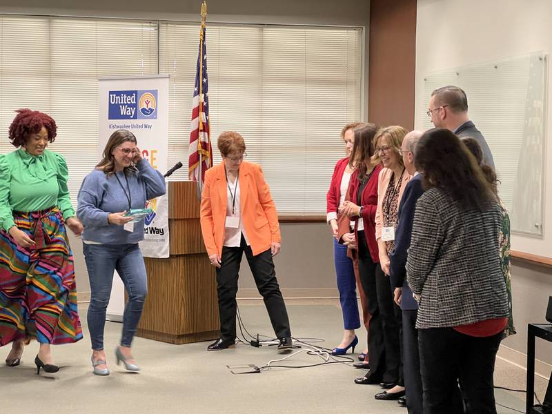 Michele Vaughn, the executive director of Kishwaukee United Way, ushers the recipient of the 2024 Leo Olson Award, Shannon Alamia, to meet with the Kishwaukee United Way board of directors on Feb. 27, 2024.