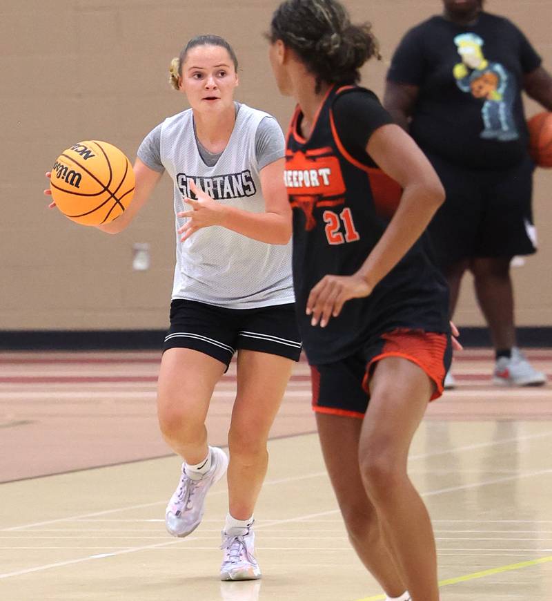 Sycamore’s Grace Amptmann pushes the ball up the court during their summer game against Freeport Monday, June 17, 2024, at DeKalb High School.