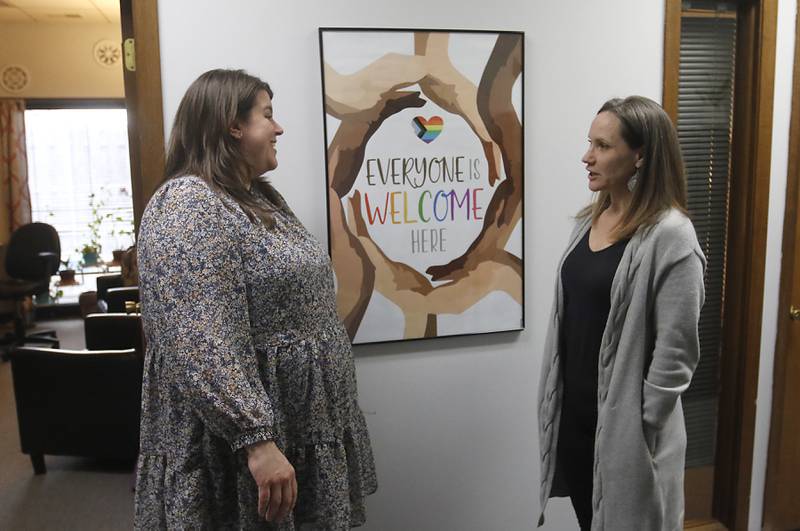 Rebecca Plascencia, the deputy director of Northwest Center Against Sexual Assault, talks with Executive Director Carrie Estrada at the center’s offices in Arlington Heights on Thursday, March 9, 2023.