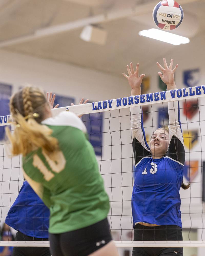 Newark's Rylie Carlson attempts to block a strike from Tessa Krull of Seneca High School during the match at Newark Community High School on September 9, 2024.