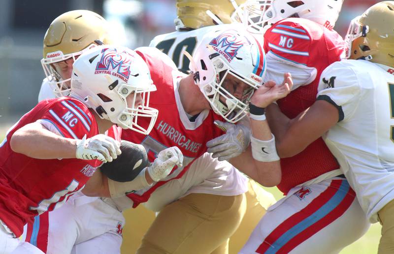 Marian Central’s Dan French, left, Robert Hernon, center, and others block against Bishop McNamara in varsity football action on Saturday, Sept. 14, 2024, at George Harding Field on the campus of Marian Central Hig