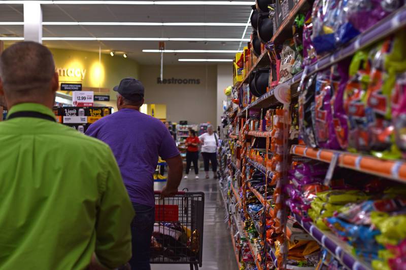 Hometown Hero grand prize winner Matt Ramer is cheered on as he shops through the seasonal candy section.