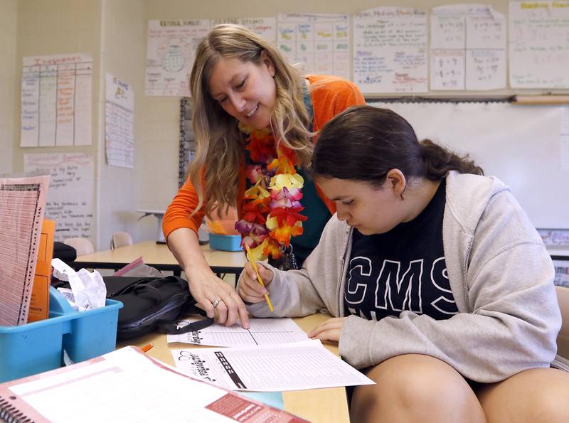 Shanon Laidig works with student Anna Castillo, as she teaches a sixth-grade math class on Friday, May 17, 2024, at Creekside Middle School in Woodstock. Laidig was recently named 2024 McHenry County Educator of the Year during the Educator of the Year Dinner.