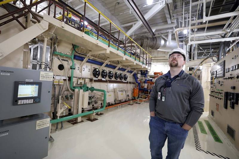 Engineer Connor Friedrichsen looks over a diesel generator at the Byron Generating Station Tuesday, Oct. 17, 2023, in Byron.