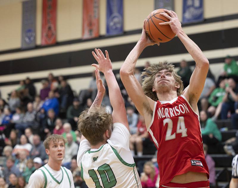 Morrison’s Brenden Martin puts up a shot over Rock Falls’ Kuitim Heald Wednesday, Feb. 21, 2024 at the Prophestown class 2A basketball regional.