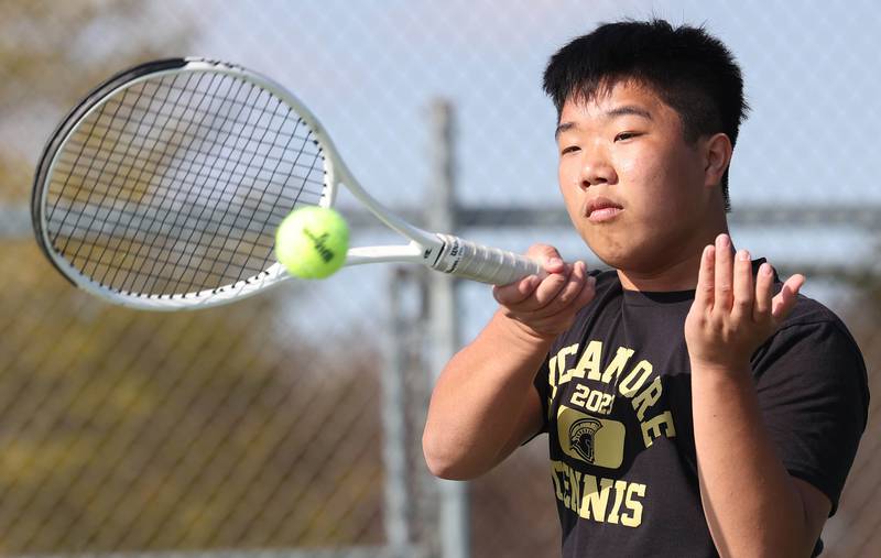 Sycamore number two singles player Regan Ni hits a forehand Wednesday, April 26, 2023, during their match against DeKalb at Sycamore High School.