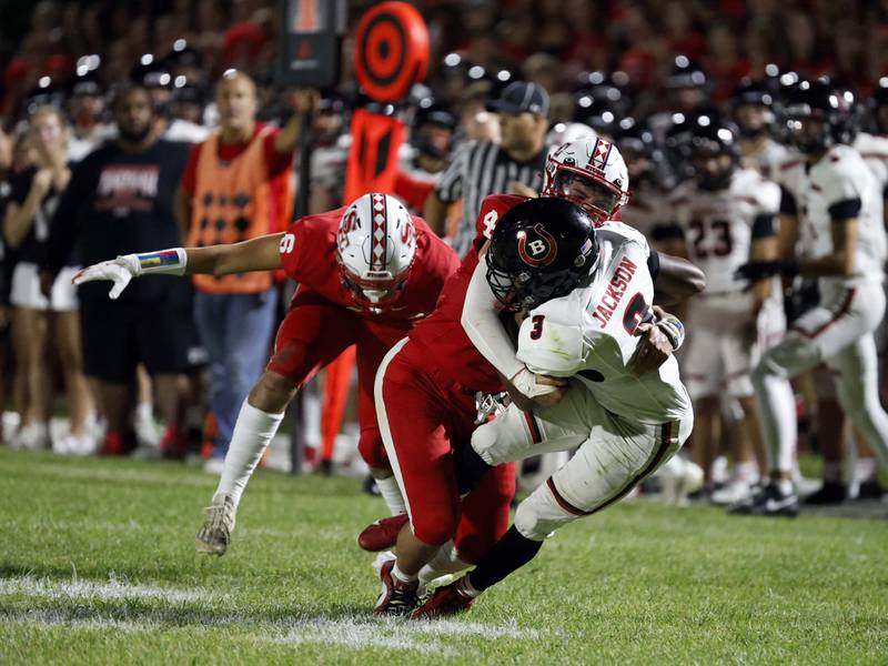 South Elgin's Zacharia Barkho (44) wraps up Barrington's Calvin Jackson (3) Friday, Aug. 30, 2024 in South Elgin.