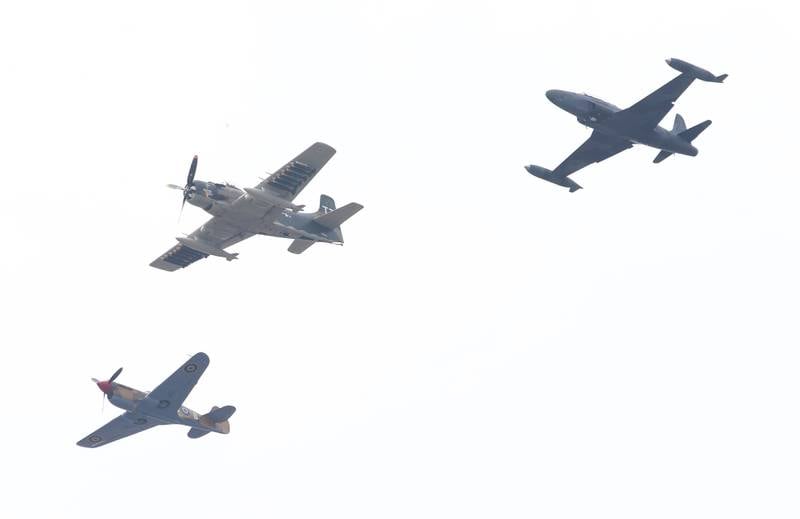 A Curtiss P-40 Warhawk, AD-4 Skyraider and a Lockheed T-33 perform a legacy flight during the TBM Avenger Reunion on Friday, May 19, 2023 at the Illinois Valley Regional Airport in Peru.