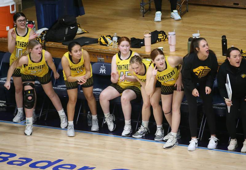 Members of the Putnam County girls basketball team cheer on their teammates during the Class 1A Regional semifinal game on Monday, Feb. 12, 2024 at Marquette High School.