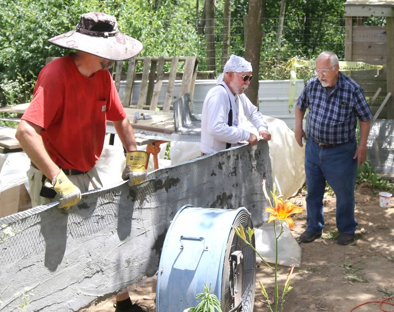Volunteers build a pond Tuesday, June 18, 2024, at Oaken Acres Wildlife Center in Sycamore. Oaken Acres is celebrating its 40th anniversary this year.