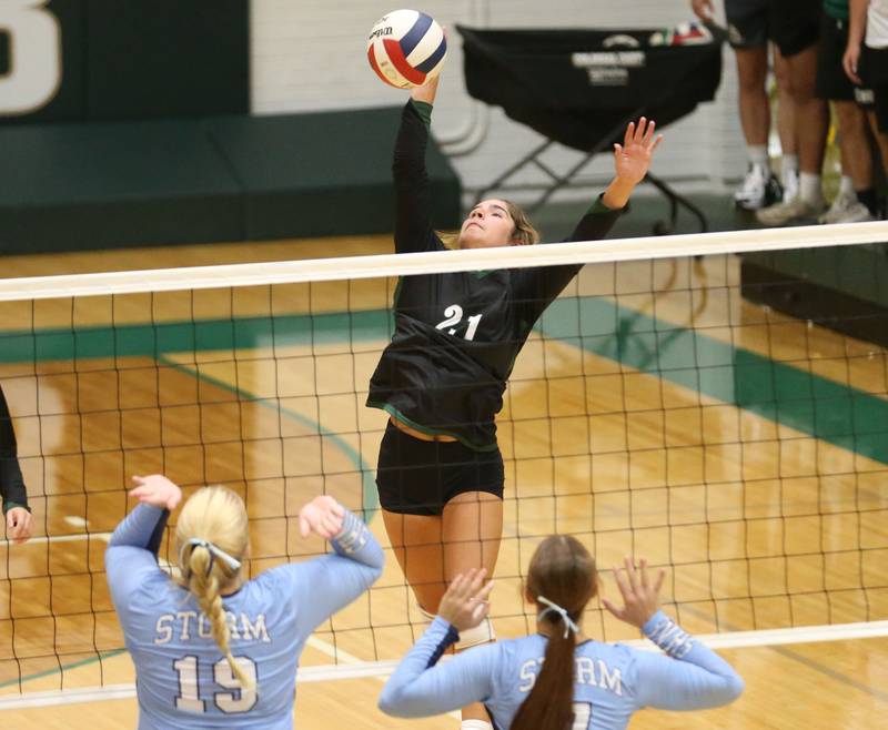 St. Bede's Lily Bosnich spikes the ball over Bureau Valley's Emma Stull and teammate Kinley Canady on Monday, Sept. 9, 2024 at St. Bede Academy.