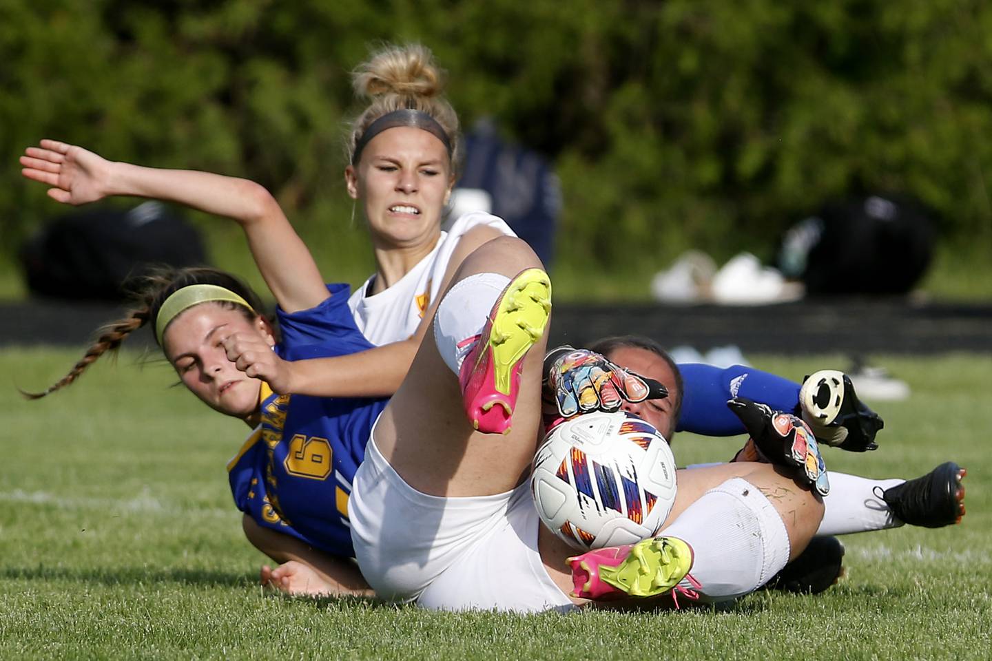 Richmond-Burton's Taylor Labay tries to regain control after taking it away from Johnsburg's Elizabeth Smith as Richmond-Burton's Blake Frericks provides defense during the IHSA Class 1A Marian Central Sectional Championship match on Tuesday, May 21, 2024, at Marian Central High School.