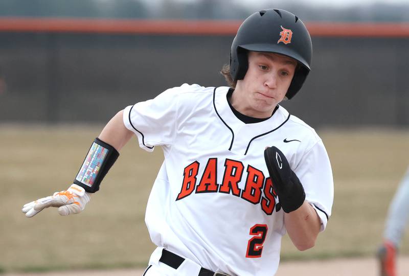 DeKalb's Jack Ager rounds third on his way to scoring a run during their game against East Aurora Wednesday, March 13, 2024, at DeKalb High School.