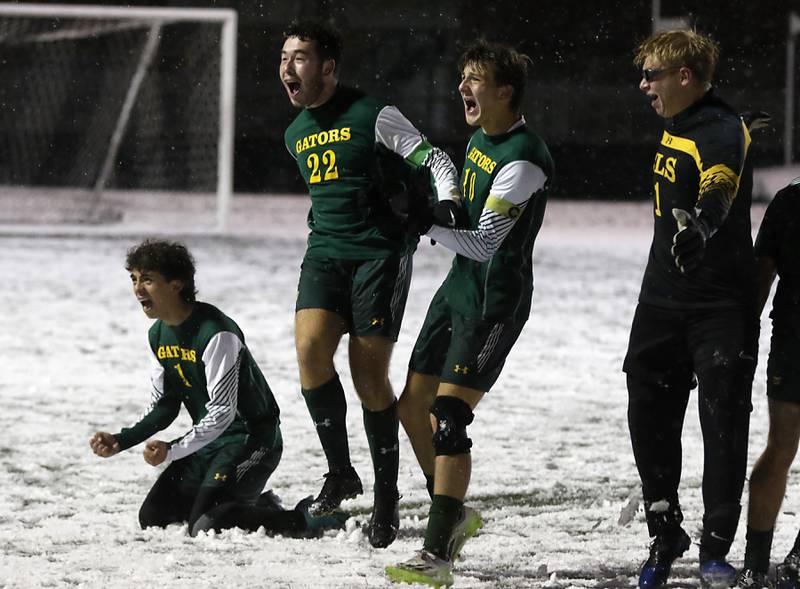 Crystal Lake South's Nico Velasco, (from left to right) Garrett Hess, Nolan Getzinger, and Chris Slawek celebrate defeating Timothy Christian in the IHSA Class 2A Grayslake Central Supersectional soccer match on Tuesday, Oct. 31, 2023, at Grayslake Central High School.