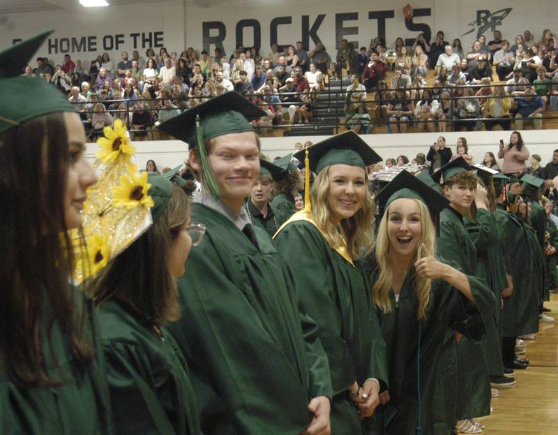 Jariese Campos, Mason Burns and Savannah Buford  wait for their diplomas. Rock Falls High School held the Class of 2024 commencement at Tabor Gym at Rock Falls High School on Sunday, May 26, 2024.
