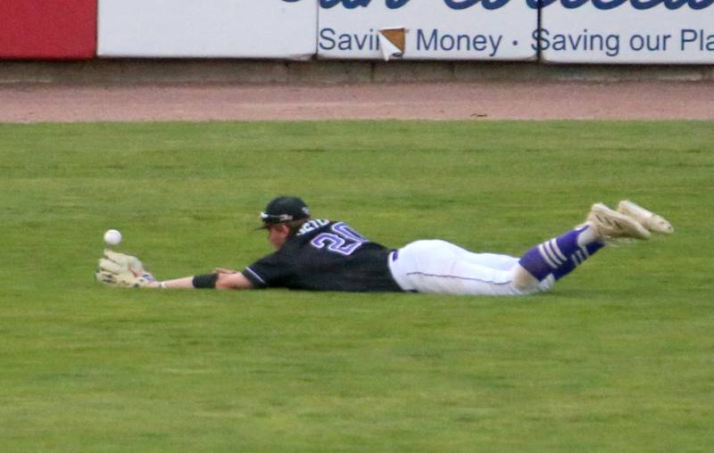 Wilmington's Reid Juster dives and misses a catch during the Class 2A semifinal game on Friday, May 31, 2024 at Dozer Park in Peoria.