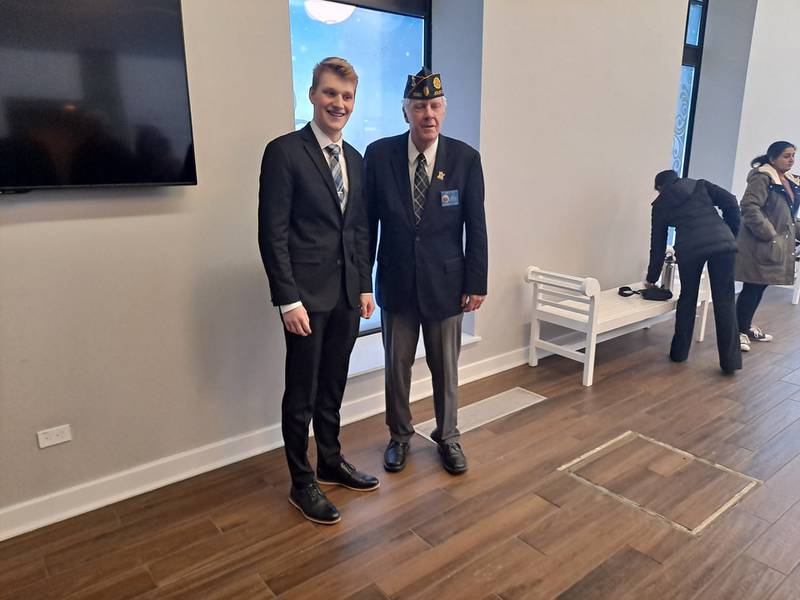 Sam Maue, 17, of Homer Glen, poses with Gary Stieg, finance officer of American Legion Post 1080 in Joliet. Maue won first place at the local level for the 2024 Department of Illinois Americanism Essay Contest and will now compete at the district level.
