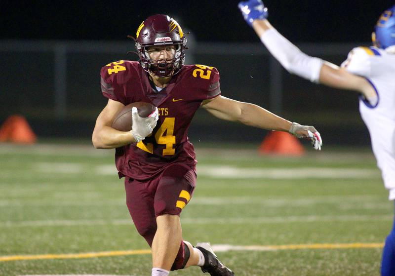 Richmond-Burton’s  Hunter Carley runs the ball against Johnsburg in varsity football action on Friday, Sept. 13, 2024, at Richmond-Burton High School in Richmond.