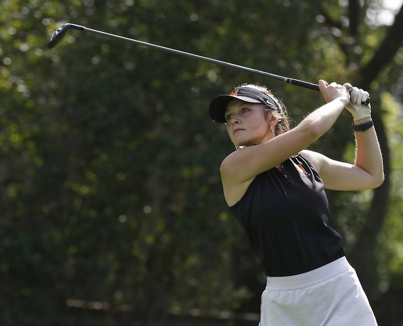 McHenry’s Aubree Lundin watches her tee shot during the Fox Valley Conference Girls Golf Tournament Wednesday, Sept. 21, 2022, at Crystal Woods Golf Club in Woodstock.