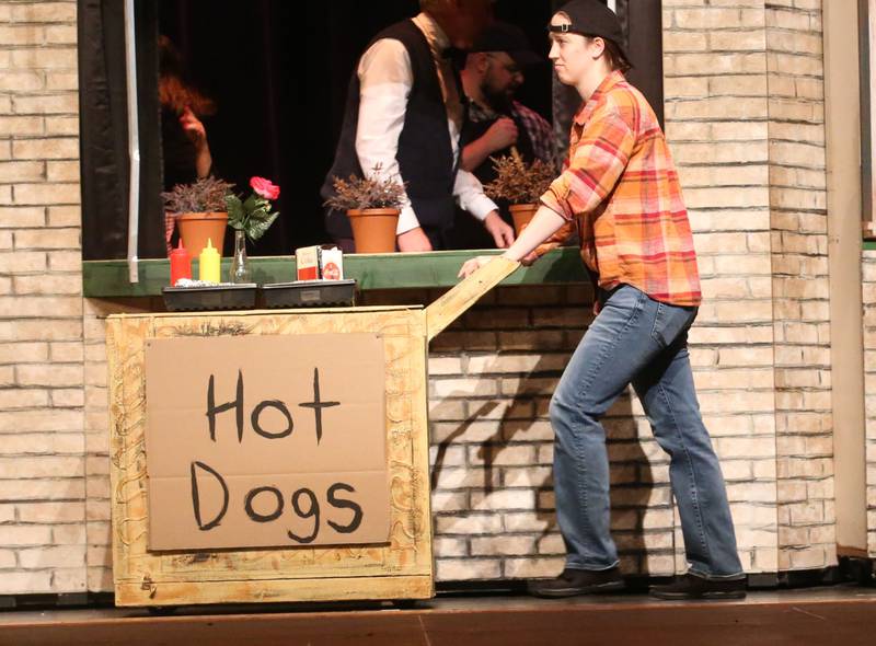 Abby Hesslau as a resident (hot dog vendor) of Skid Row acts out a scene during a rehearsal of  "The Little Shop of Horrors"  in the Mendota Community Theatre on Monday, June 17, 2024 at Mendota High School.