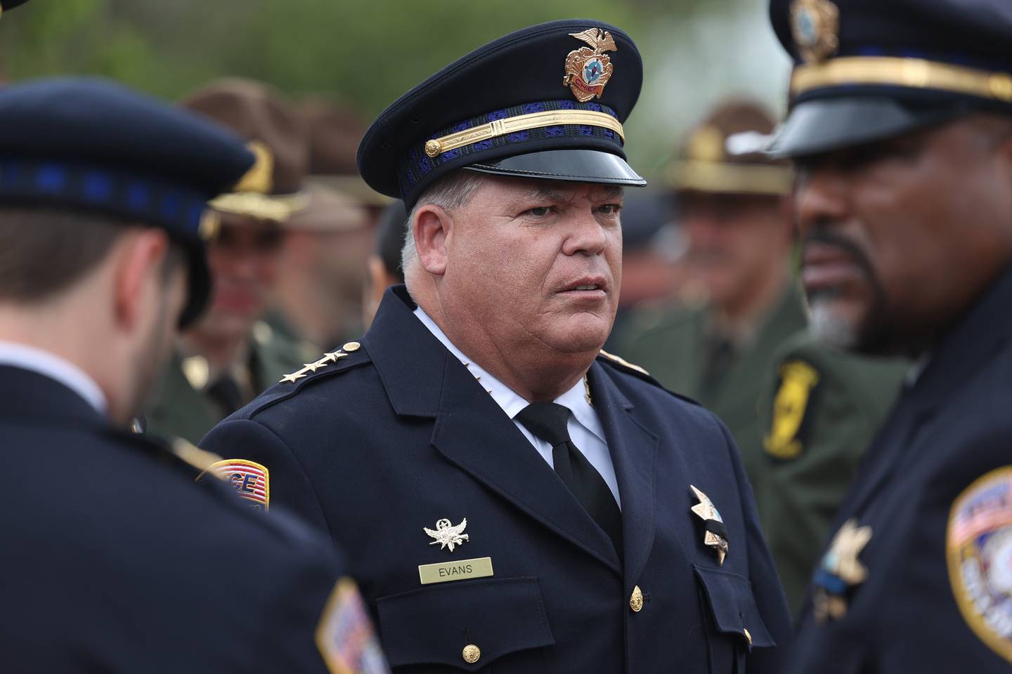 Joliot Police Chief William Evans talks with fellow officers after the Will County Law Enforcement Memorial ceremony on Thursday, May 9, 2024 in downtown Joliet.