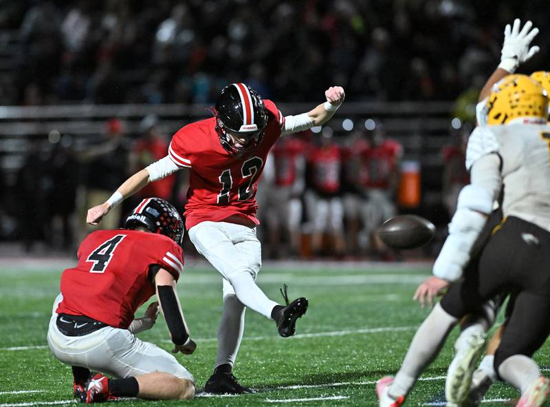 Lincoln-Way Central's Andrew Schiller kicks the extra point during the class 7A first round  playoff game against Jacob on Friday, Oct. 27, 2023, at New Lenox. (Dean Reid for Shaw Local News Network)