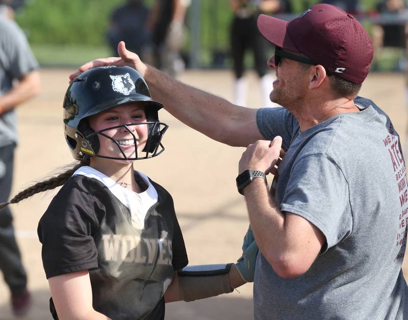 Prairie Ridge's Adysen Kiddy is all smiles after scoring the first run of their Class 3A sectional final against Sycamore Friday, May 31, 2024, at Sycamore High School.