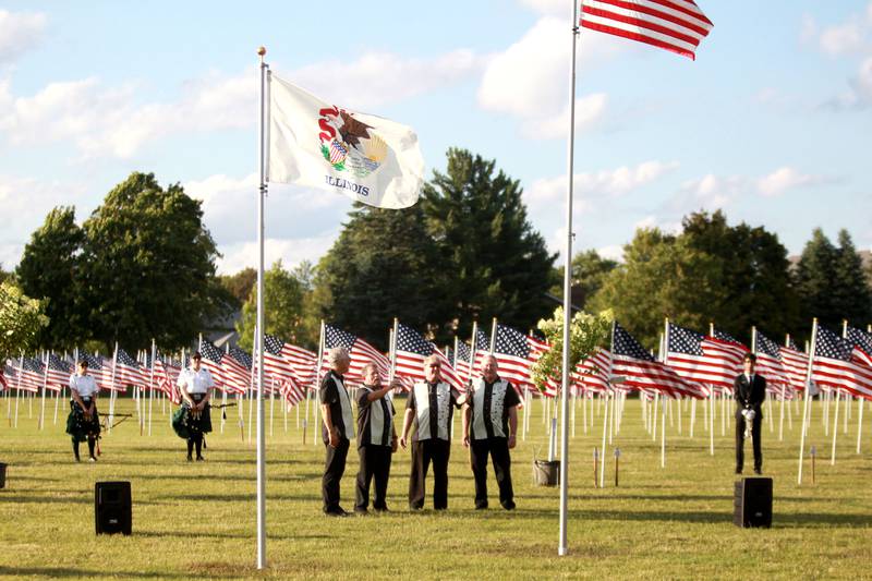 The Upside Downers vocal group sing during the opening night of the Field of Honor at Seven Gables Park in Wheaton on Saturday, June 29, 2024.