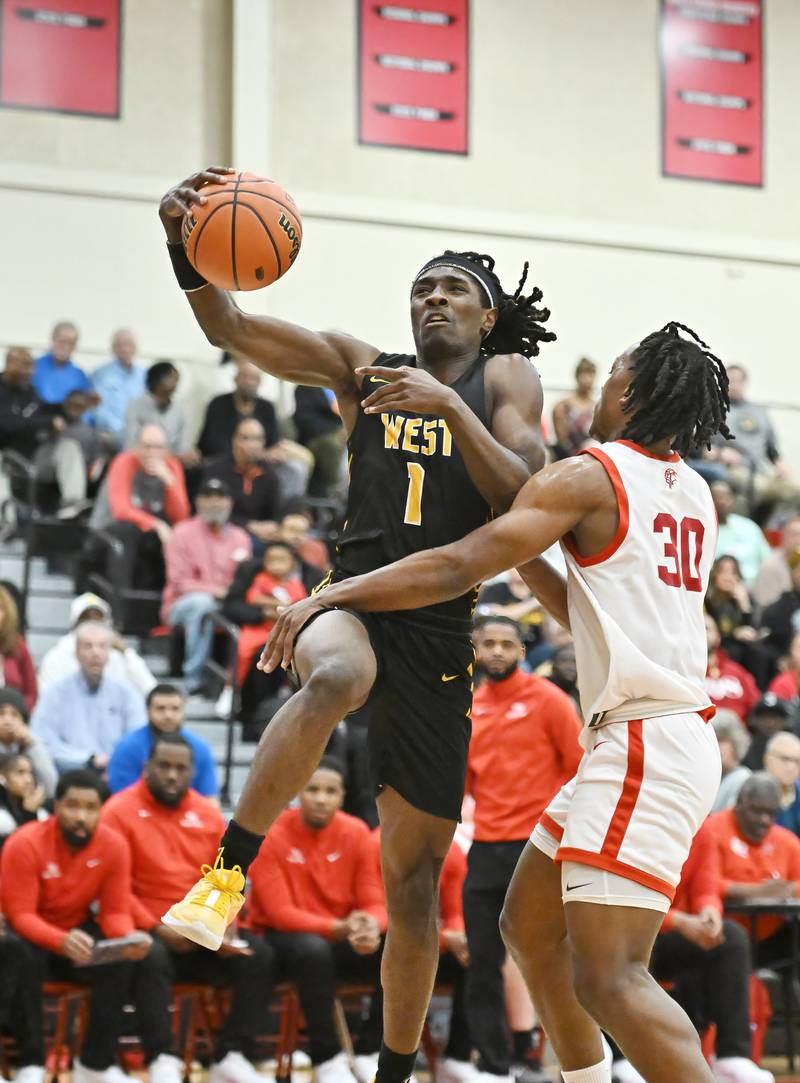 Joliet West's Justus Mcnair drives to the basket for a layup during the Class 4A sectional semifinal against Homewood Flossmoor at Rich Township on Tuesday, Feb. 27, 2024, at Richton Park. (Dean Reid for Shaw Local News Network)