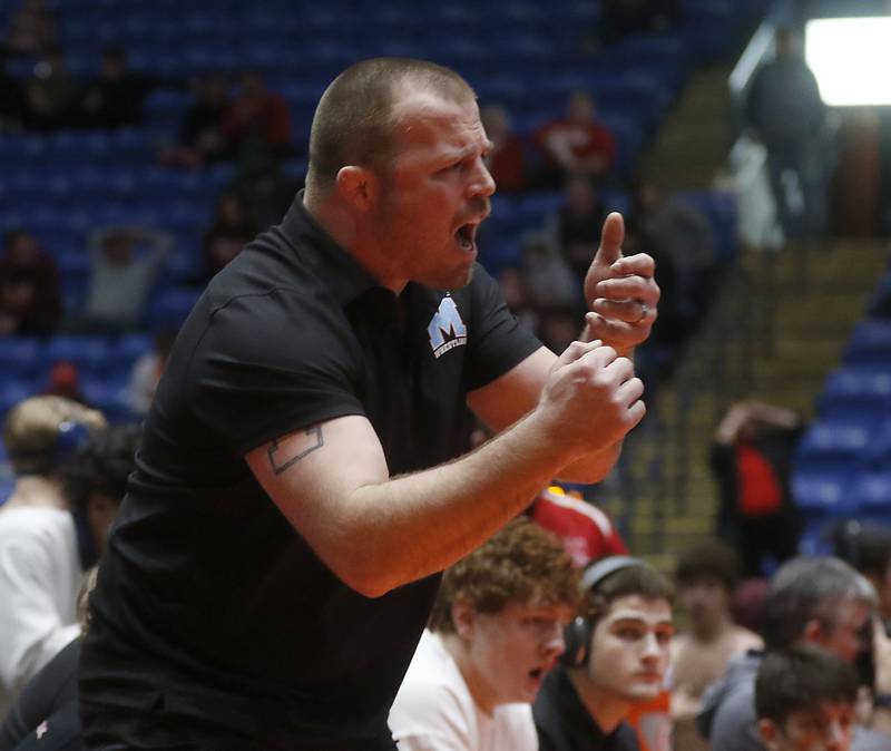 Marina Cenrtral Head Coach Jordan Blanton cheers on his wrestlers during the IHSA Class 1or2A Dual Team Sate Championship match Saturday, Feb. 24, 2024 at Grossinger Motors Arena in Bloomington.