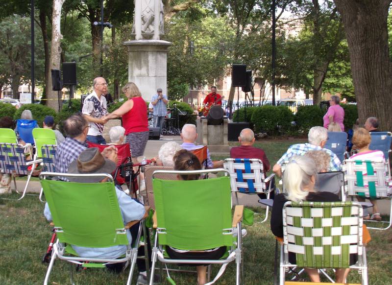 Hundreds of people brought lawn chairs Saturday, July 2, 2022, to watch the Radium City Rebels perform to open the 2022 Music in the Park series at Washington Square in Ottawa.