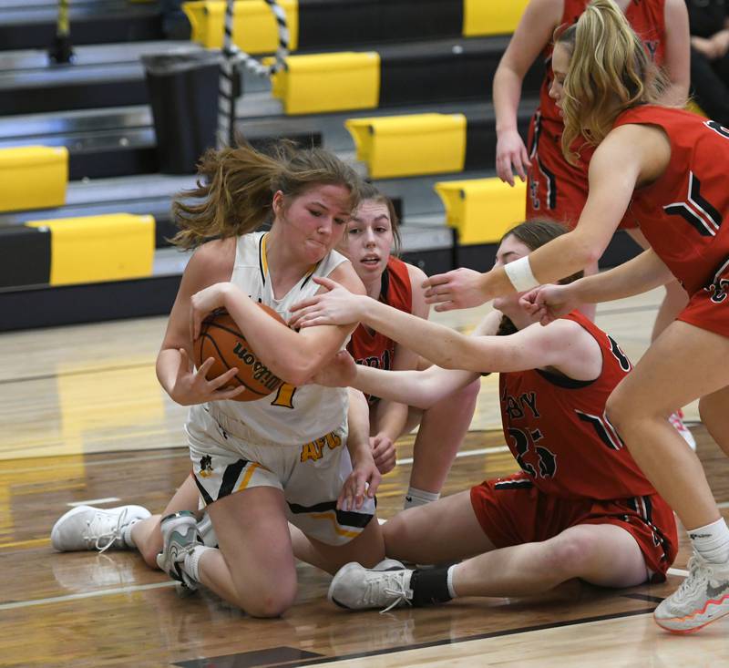 Ashton-Franklin Center's Alexis Schwarz (1) rips the ball away from Amboy's Maeve Larson, Courtney Ortgiesen (25) and Elly Jones (right) during a Feb. 7 game in Ashton.