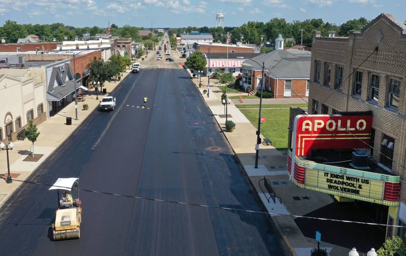 Crews pave South Main Street in front of the Apollo Theater on Tuesday, Aug. 13, 2024 downtown Princeton.