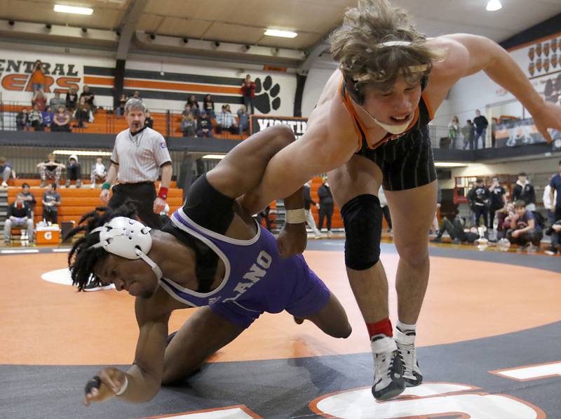 Crystal Lake Central’s Cayden Parks tries to get out of the grasp of Plano’s Prince Amakiri during the 190-pound championship match of a the IHSA 2A Crystal Lake Central Wrestling Regional on Saturday, Feb. 3, 2024, at Crystal Lake Central High School.